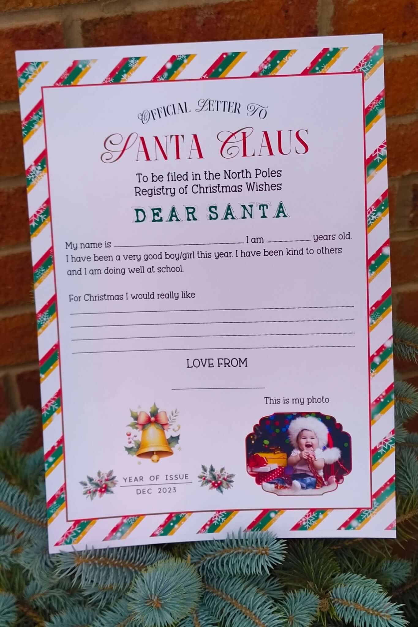 Official Letter to Santa Claus printable form with Christmas border, section for childβs name, age, good behaviour statement, and wish list, decorated with festive holly and bells.