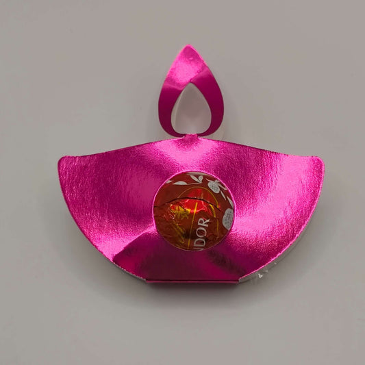 Pink metallic diya favour for Diwali, ideal for holding sweets and gifts, with a shiny finish.