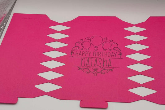 Personalised birthday crackers design in pink with 'Happy Birthday Natasha' printed.