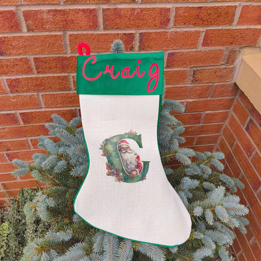 Personalised Vintage Santa Christmas Stocking with name Craig and initial C on a green cuff.