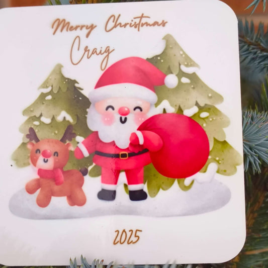 Detailed view of personalised Santa coaster with name Craig and year 2025, showing festive design with reindeer and Christmas trees.