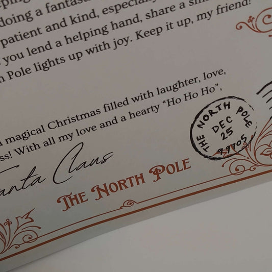 Close-up of a personalised Santa letter with a North Pole postmark, perfect for Christmas keepsake.