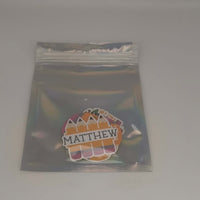 Personalised school name stickers featuring colorful pencil designs in a clear packaging for organization.