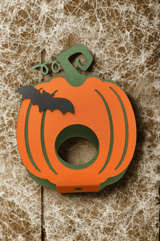 Cute Halloween pumpkin lollipop holder with bat design, perfect for kids' treats and parties.