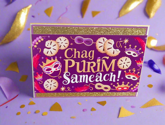 Chag Purim Sameach card with gold glitter borders, purple background, hamantaschen and mask illustrations, front angle close-up on lilac background with gold and confetti details
