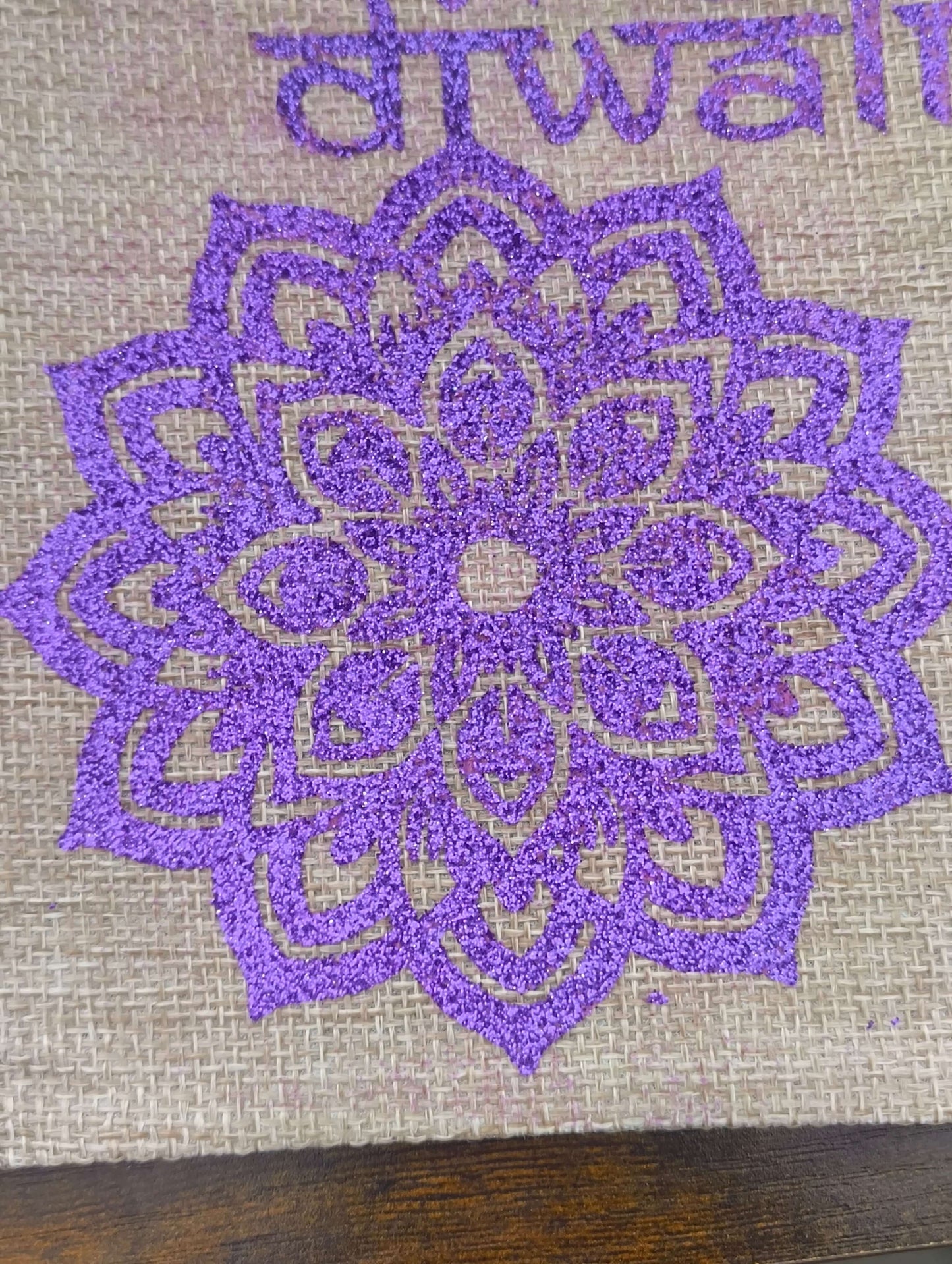Close-up of a purple mandala pattern on a hessian bag for Diwali celebrations, showcasing festive charm.
