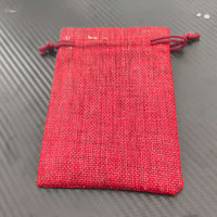 Red hessian drawstring gift pouch, perfect for Christmas presents and festive gifting.
