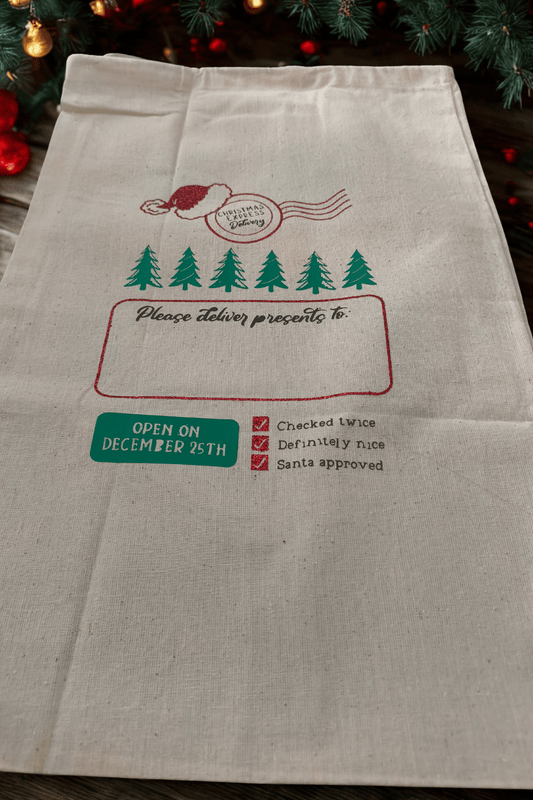 Personalised Santa sack for kids featuring holiday graphics and space for a name, perfect for Christmas gift giving.