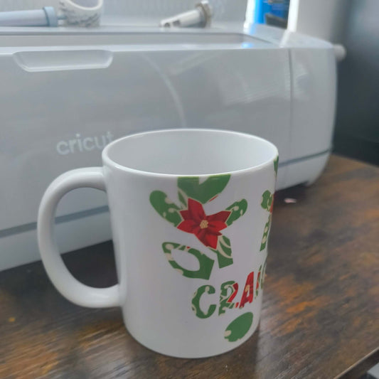 Personalised Christmas mug featuring poinsettia and holly design, perfect for festive drinks.
