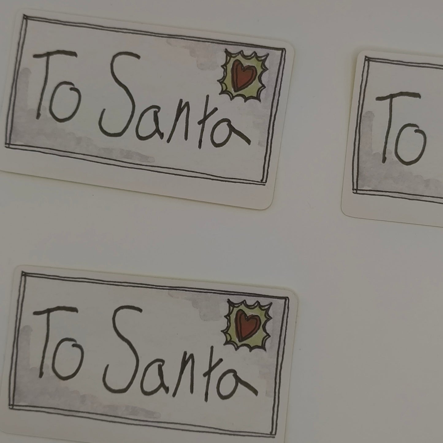 Rectangular βTo Santaβ Christmas stickers with hand-drawn style and holly stamp design