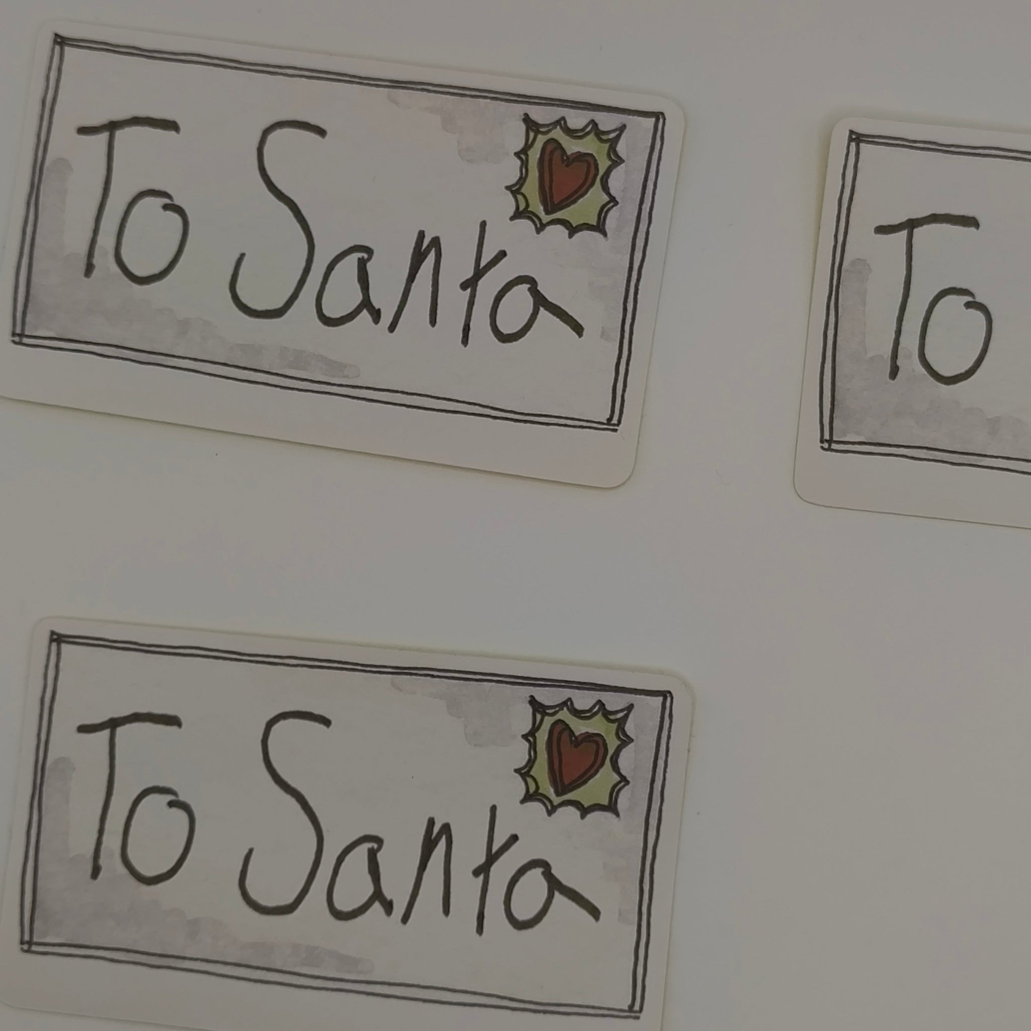 Rectangular βTo Santaβ Christmas stickers with hand-drawn style and holly stamp design