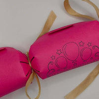 Personalised Birthday Crackers in vibrant pink with balloon designs, handmade for festive celebrations.