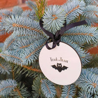 Trick or Treat Halloween bauble with bat ornament design, personalised with name and year.