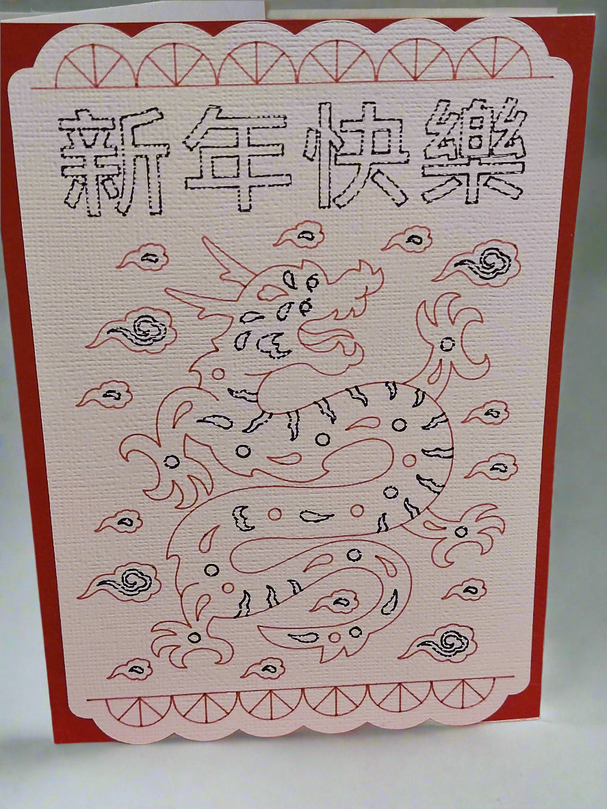 Handmade Dragon Chinese New Year card with red and pink design, featuring Chinese characters for 'Happy New Year'.