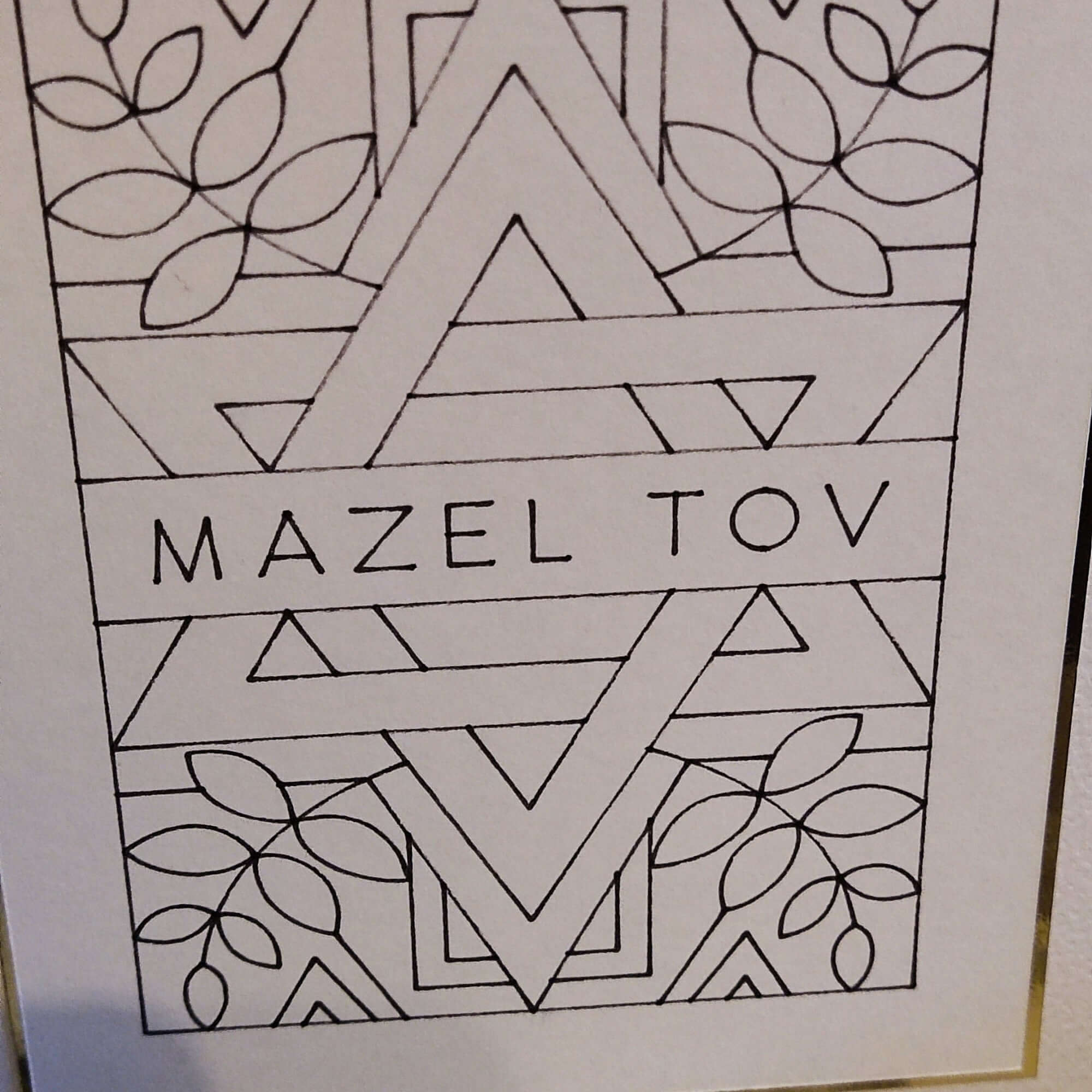 Black and white outline illustration of a Star of David with 'Mazel Tov' text, perfect for Jewish celebration cards.