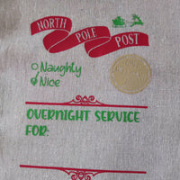 North Pole Post design on a personalised Santa delivery sack featuring 'Naughty & Nice' and 'Overnight Service For' text.