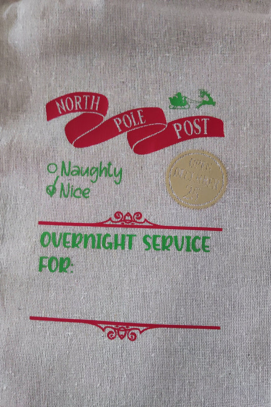 North Pole Post design on a personalised Santa delivery sack featuring 'Naughty & Nice' and 'Overnight Service For' text.