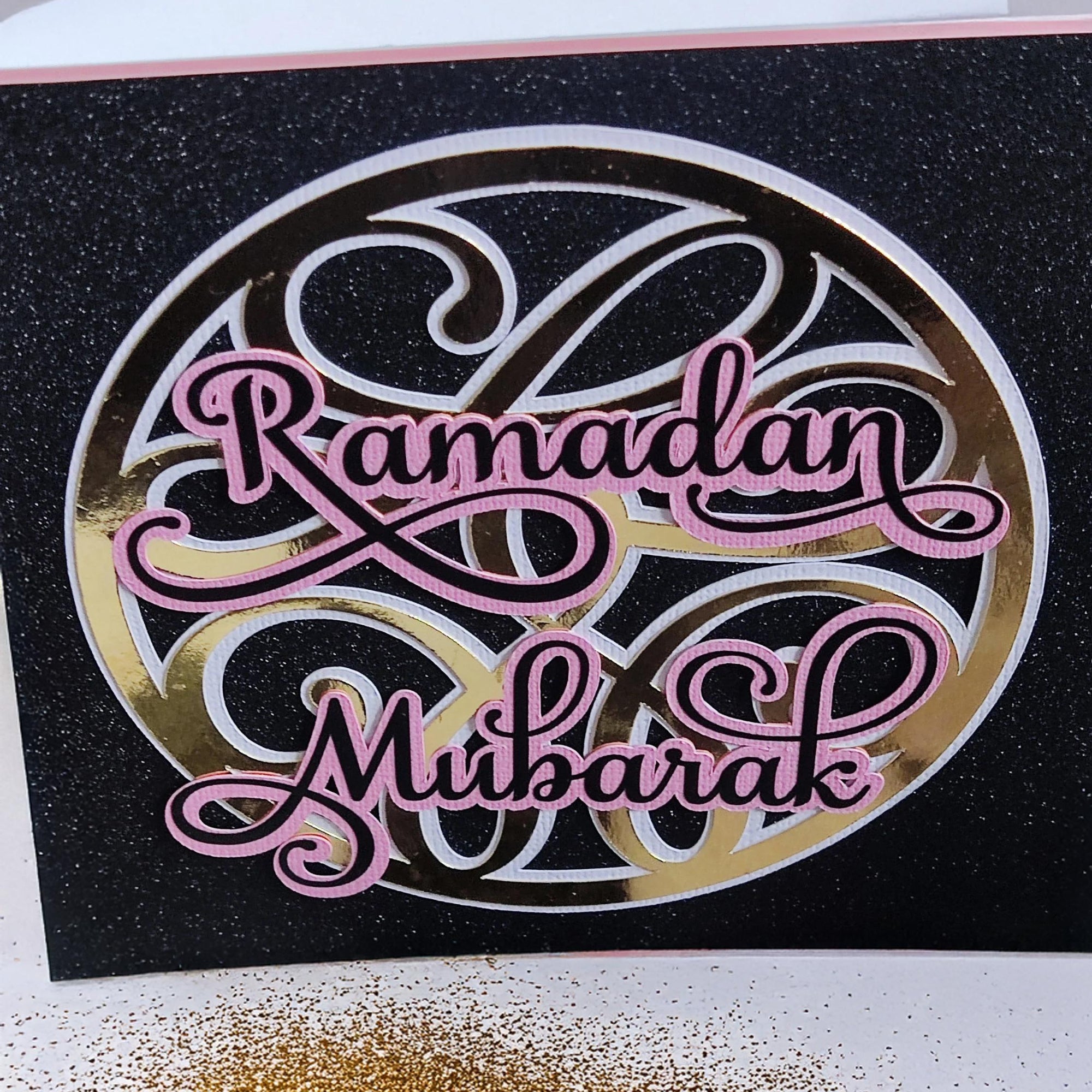 Glittery Ramadan Mubarak card, featuring elegant pink lettering on a black background, ideal for Islamic greetings.
