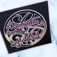 Handmade Glittery Ramadan Mubarak card with elegant script on a black background, perfect for celebrating Ramadan.