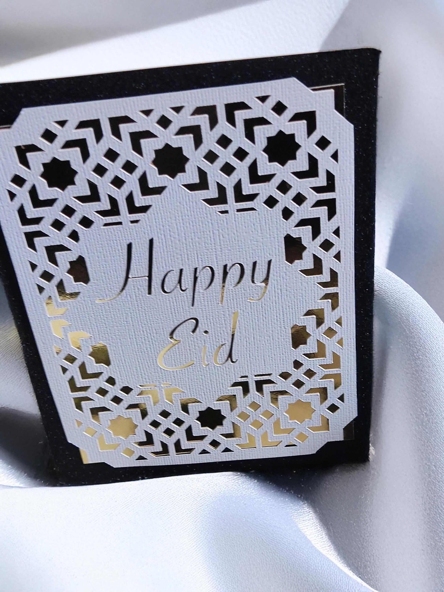 Happy Eid Card featuring laser cut Islamic geometric design, perfect for Muslim celebration greetings.