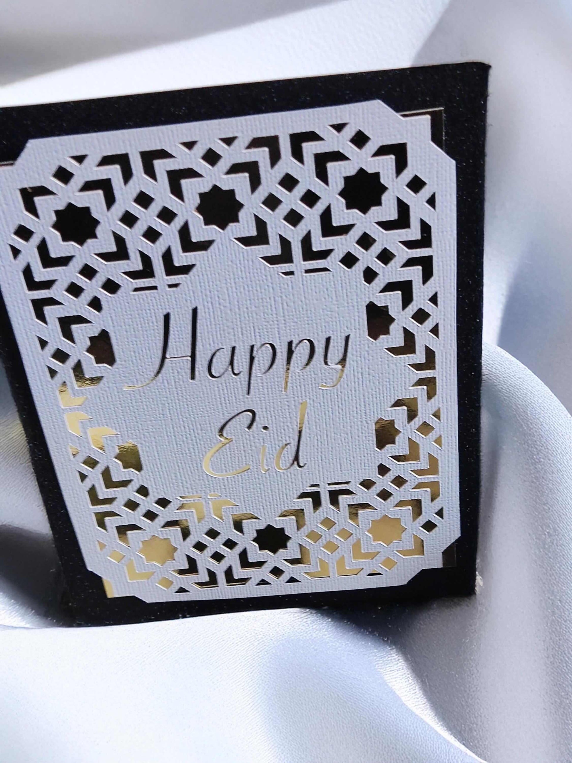 Happy Eid Card featuring laser cut Islamic geometric design, perfect for Muslim celebration greetings.