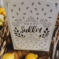 Happy Sukkot greeting card with intricate design and gold accents, perfect for holiday celebrations.