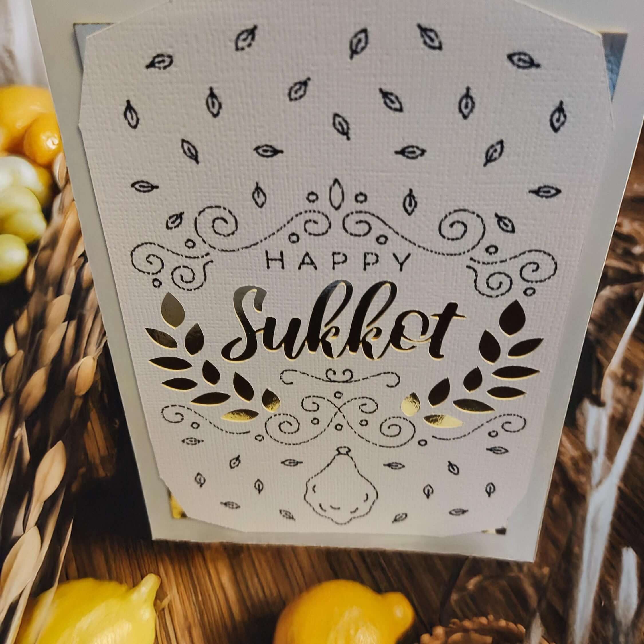 Happy Sukkot greeting card with intricate design and gold accents, perfect for holiday celebrations.