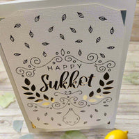 Handmade Happy Sukkot greeting card with intricate designs and gold accents.