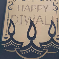 Handmade Diwali card featuring layered navy lamps and the greeting 'Happy Diwali' for festive celebrations.