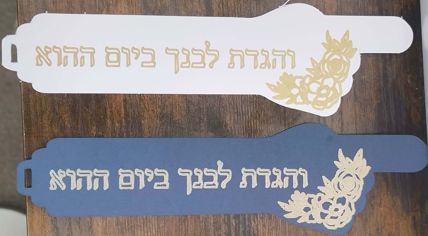 Handmade Passover bookmarks featuring Hebrew verse and gold foil floral designs on blue and white backgrounds.