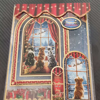 Festive Christmas card featuring three dogs peering out a snowy window with holiday decorations.