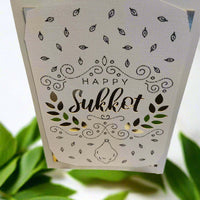 Handmade Happy Sukkot greeting card with intricate ink details and gold accents.