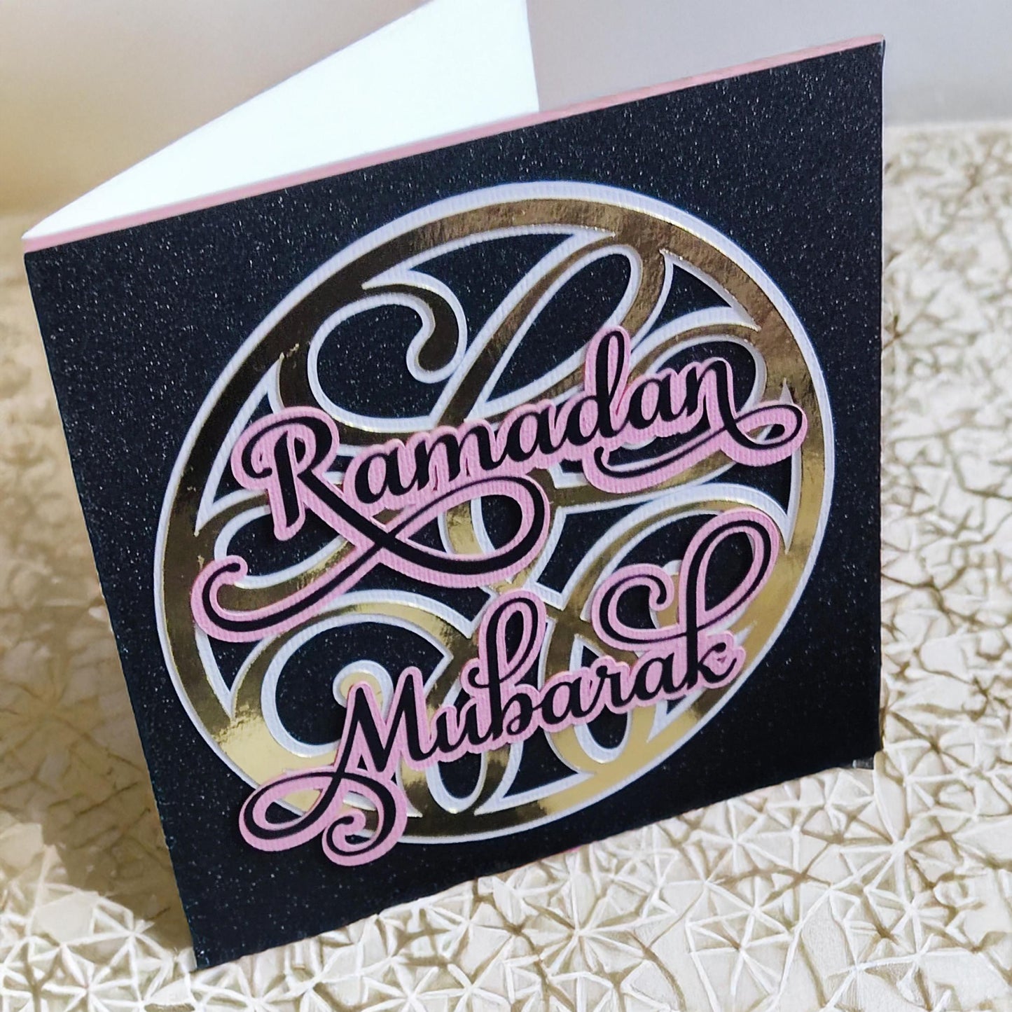 Handmade Glittery Ramadan Mubarak Card featuring elegant calligraphy on a stylish black background.