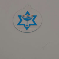 Acrylic Hanukkah decoration with menorah and Star of David design on white background.