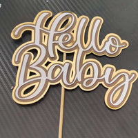 Hello Baby cake topper in gold layered cardstock design for baby shower celebrations.