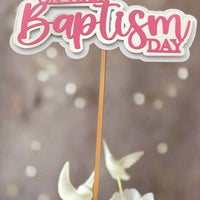 Personalised Baptism cake topper featuring the phrase 'On Your Baptism Day' in pink and white.