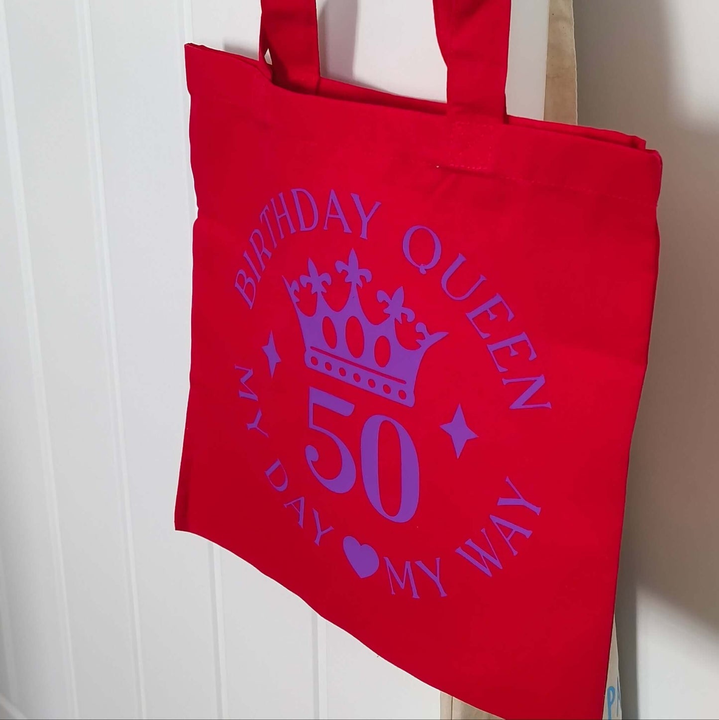 Bright red Birthday Queen 50 tote bag with crown design, perfect for celebrating a 50th birthday.