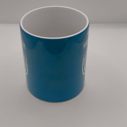 Happy Hanukkah mug in blue with festive design for celebrating the Festival of Lights.