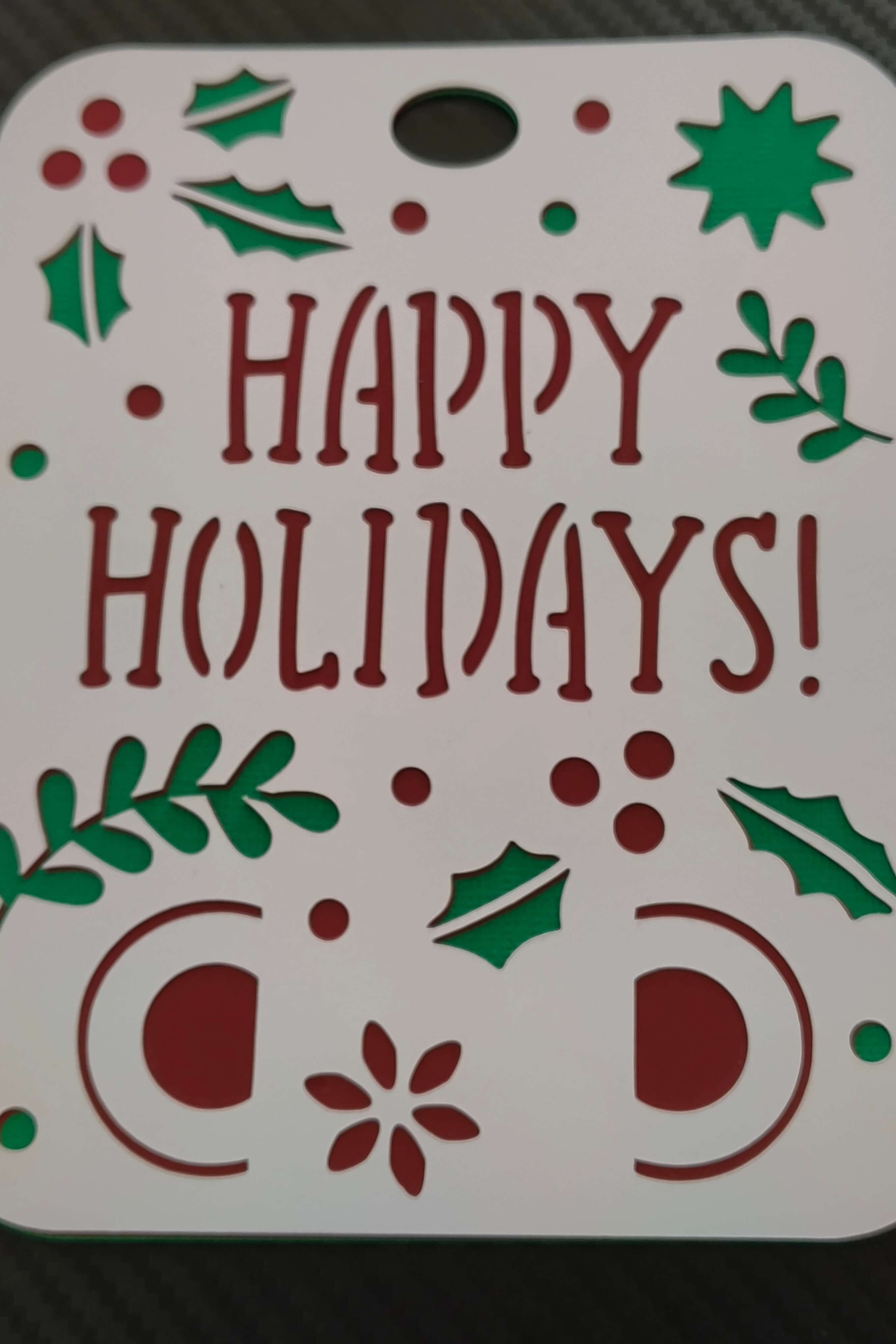 Christmas Happy Holidays card with layered cardstock and festive holly decoration.