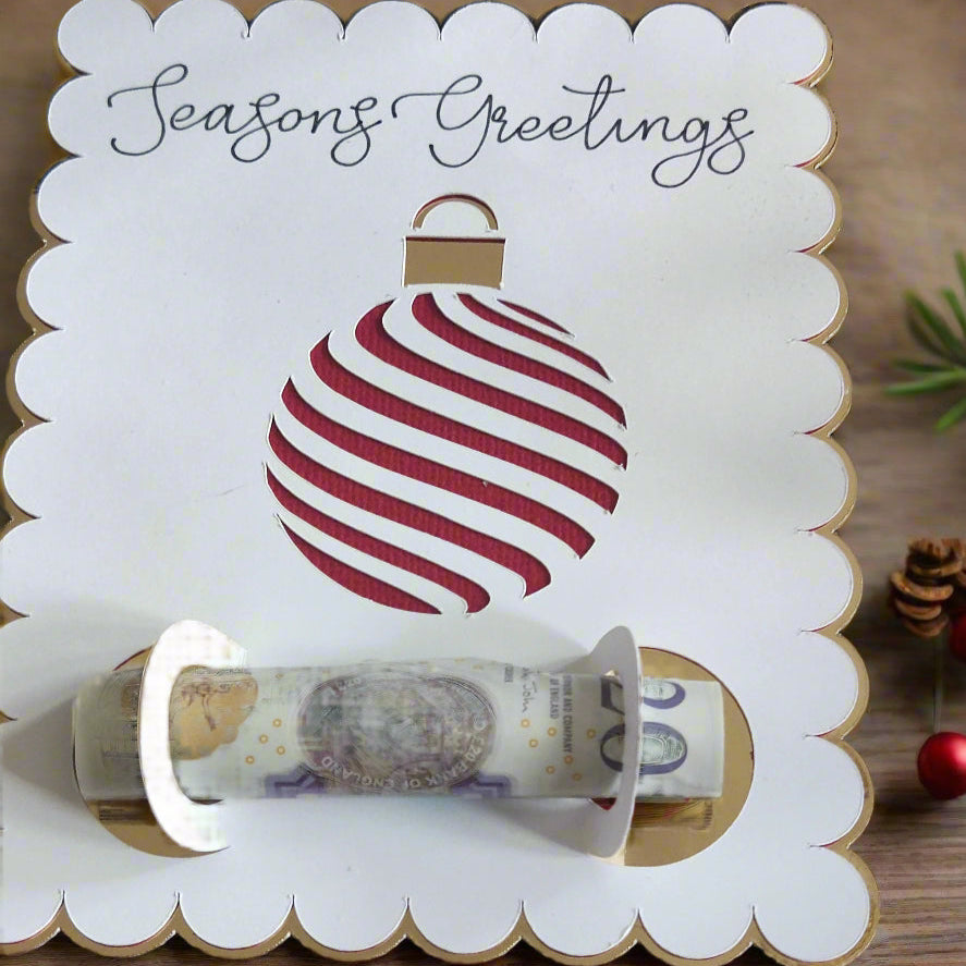Handmade Christmas Money Holder Card with festive red and white ornament design, gold foil accents, and "Seasons Greetings" script, holding cash gift.