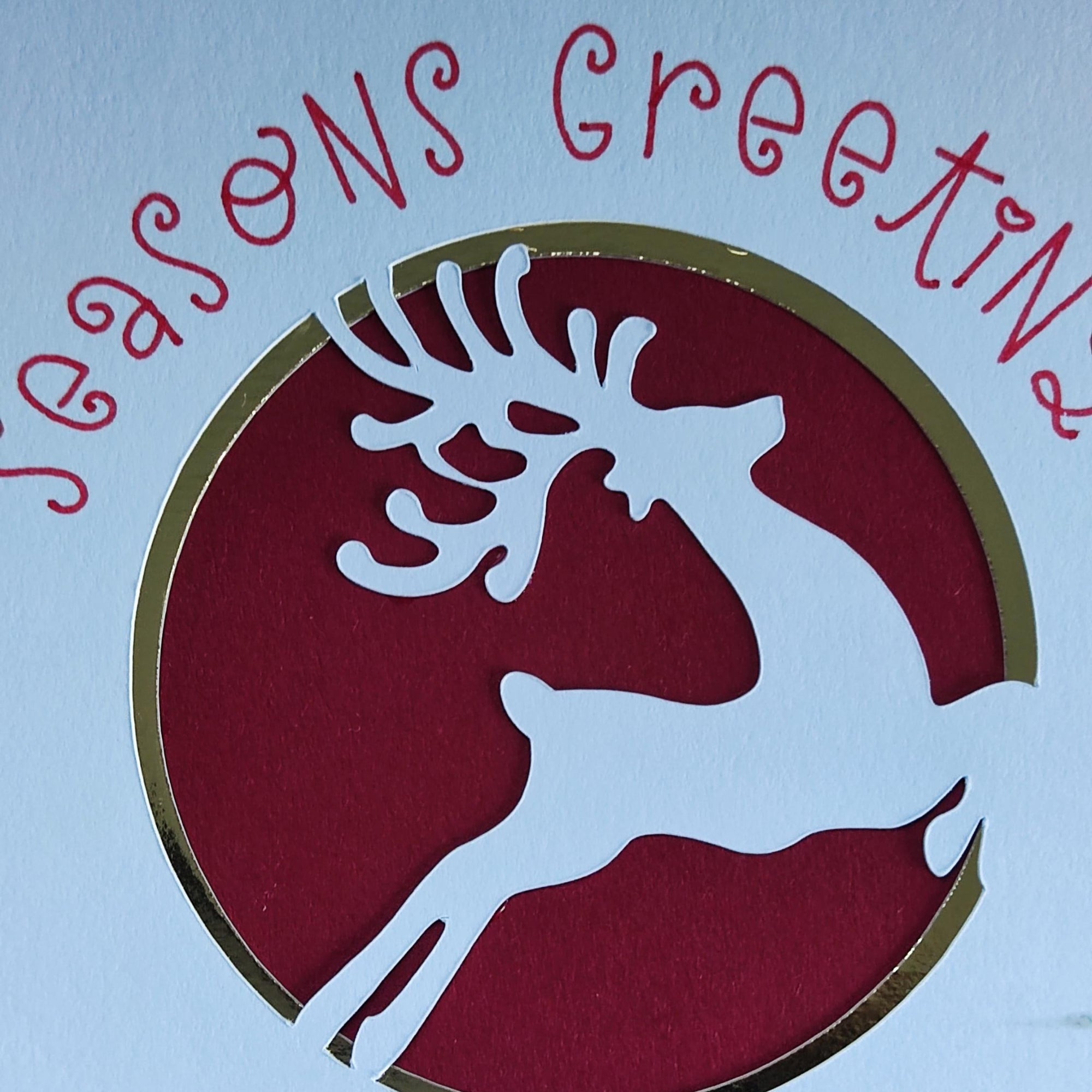 Handmade Christmas Money Holder Card with reindeer cut-out, gold foil accents, and "Seasons Greetings" text for festive cash gifts