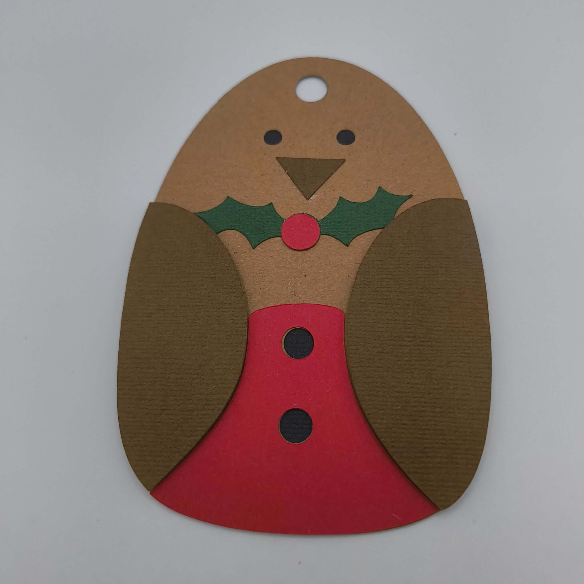 Handmade Christmas robin gift tag in brown and red cardstock with holly detail.
