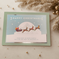Personalized Christmas card featuring Santa with reindeer, ideal for festive holiday magic.