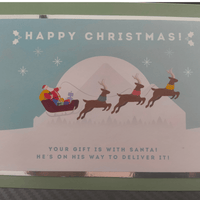 Colorful Christmas card featuring Santa with reindeer, delivering gifts, and a festive message.
