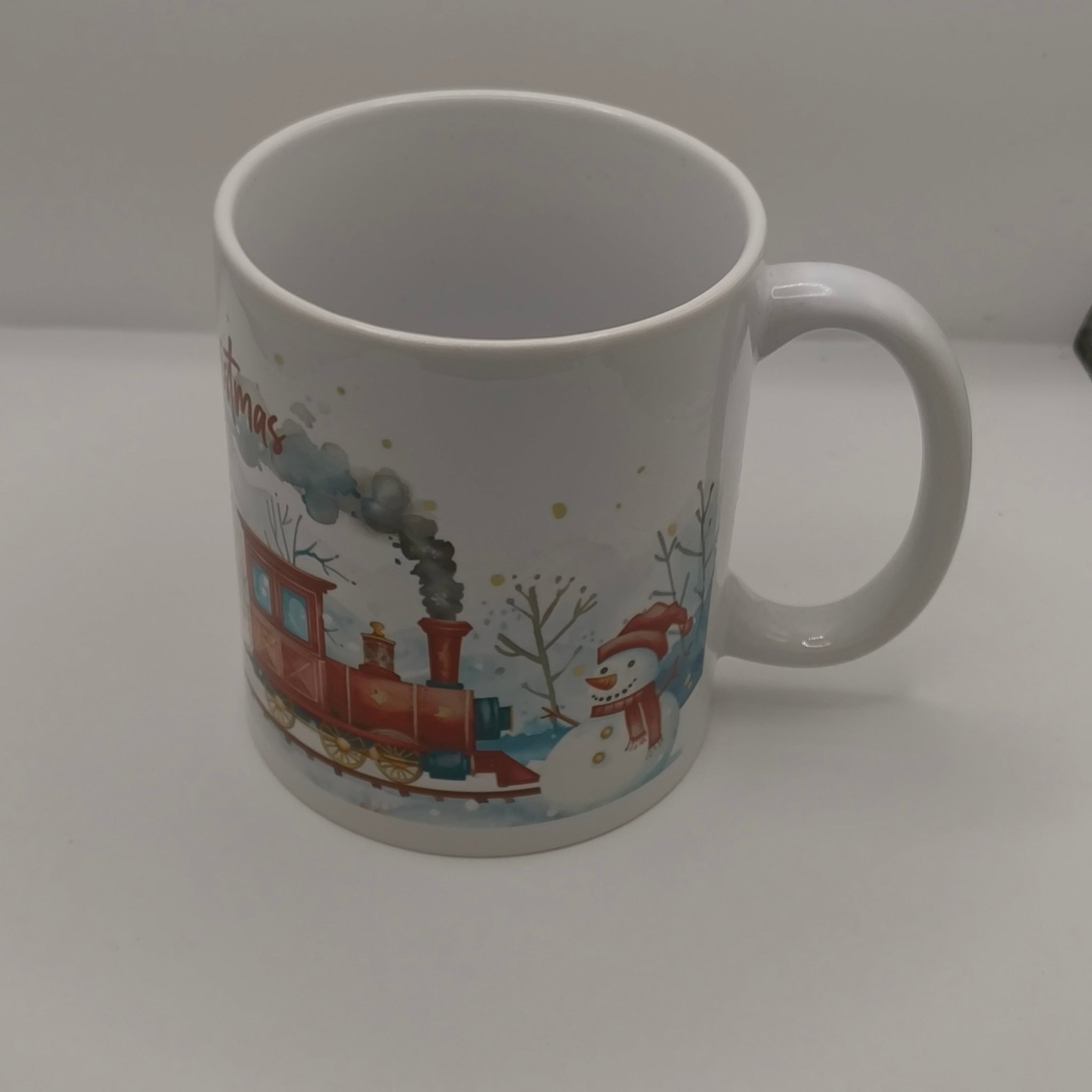 Christmas mug with steam train and snowman winter scene