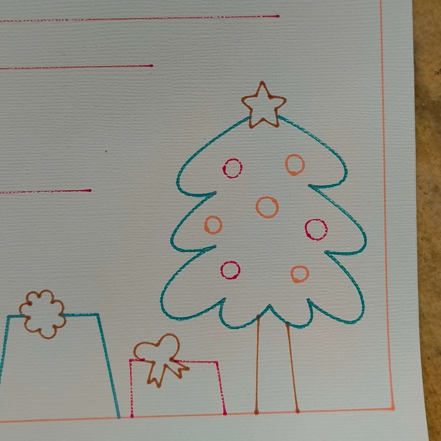 Illustrated Christmas tree and gifts on personalised Father Christmas letter template for kids.