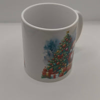 White festive mug with Christmas tree and gift illustration, plain background view