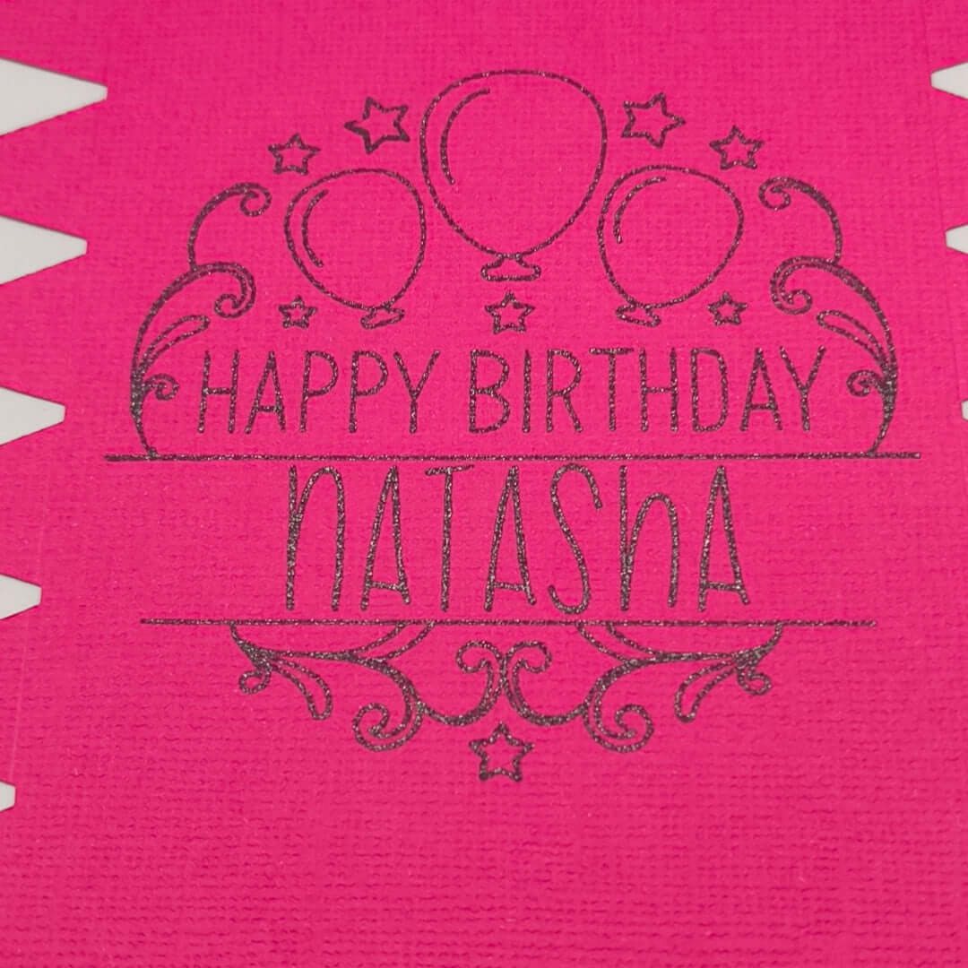 Personalised birthday crackers in vibrant pink with 'Happy Birthday Natasha' and balloon design.