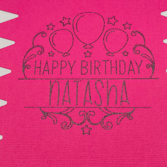 Personalised birthday crackers in vibrant pink with 'Happy Birthday Natasha' and balloon design.
