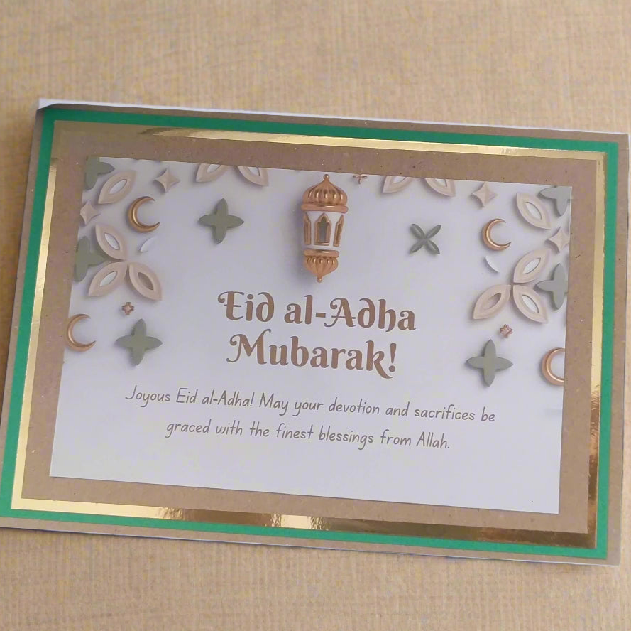 Handmade Eid al-Adha greeting card featuring gold accents and festive designs, perfect for celebrating the holiday.